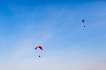 Fototapeta na wymiar Two paraglider flying in the sky