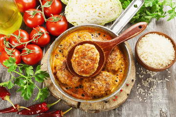 Meat cutlets with cabbage and rice