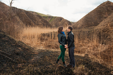 Fototapeta premium Happy couple smiling outdoors in the mountains