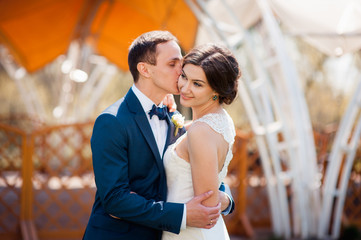Bride and groom walking at the river