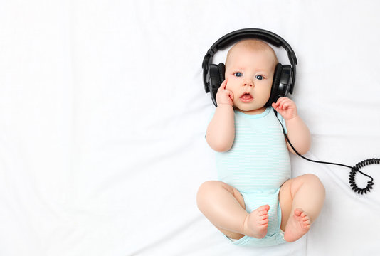 baby little boy in headphones