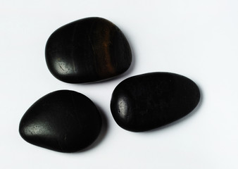 Three black zen stones, spa beauty and wellness concept