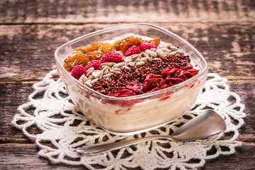 Breakfast banana smoothie bowl topped with goji berries,raspberry