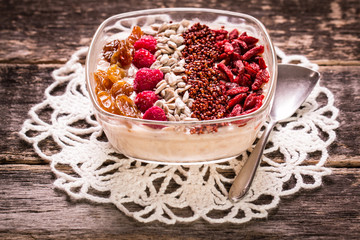 Breakfast banana smoothie bowl topped with goji berries,raspberry