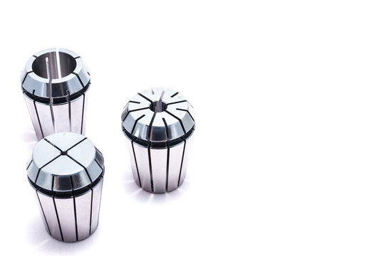 Metal collets for instruments for heavy industry on white background