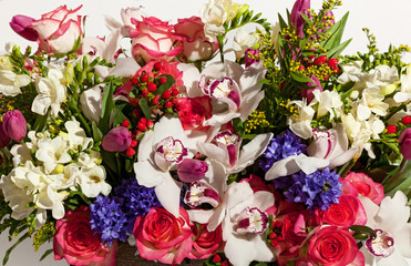 flower composition on a white background orchid roses, bridal bo