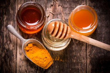 honey and turmeric on wooden table.healthy food