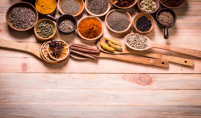 spices and herbs on wooden table.