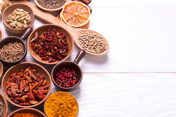 spices and herbs on wooden table.