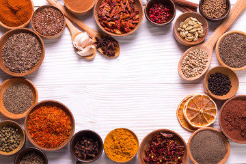 spices and herbs on wooden table.