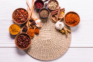 spices and herbs on wooden table.