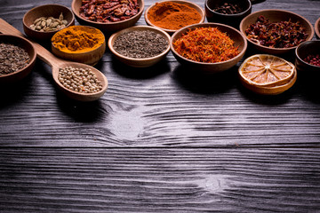 spices and herbs on wooden table.