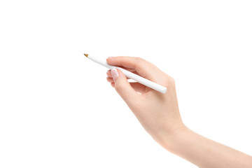 Female hand holds a pen on a white background.