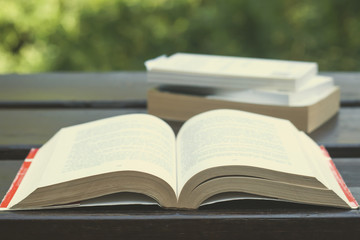 books on a wooden garden table