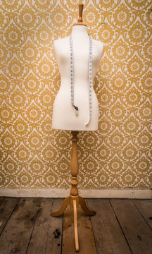 mannequin dress form and tape measure vintage  background