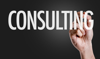Hand writing the text: Consulting