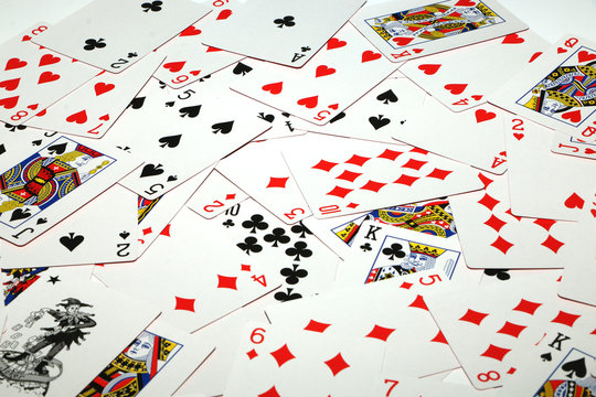 Playing cards laid out on a white background