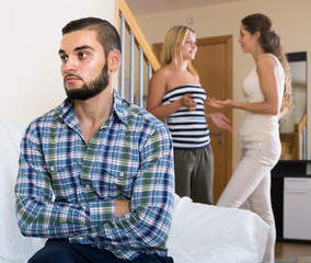 person keeping silence turned away from friends