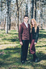 Stunning sensual outdoor portrait of young stylish fashion couple