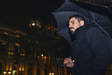 Handsome man walking in Madrid.