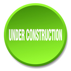 under construction green round flat isolated push button