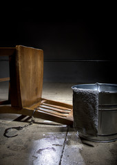 Torture chamber with a water bucket for controversial waterboarding