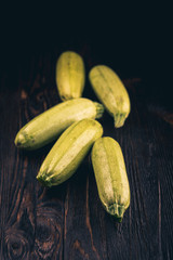 Fresh zucchini on wooden table