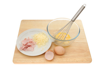 Omelette ingredients on a wooden board