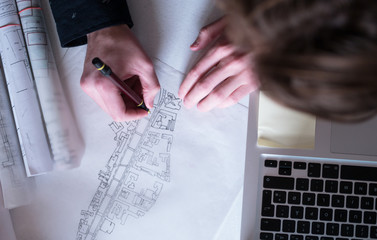 Office desk background with construction project ideas concept,