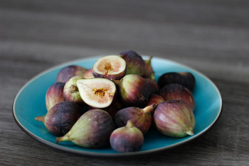 Fresh California figs on a turquoise plate