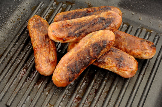 Fried Pork Sausages In A Griddle Frying Pan