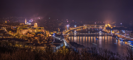 New Year Celebration. Fireworks over Budapest, Hungary. Illuminated Royal Palace by Danube River.