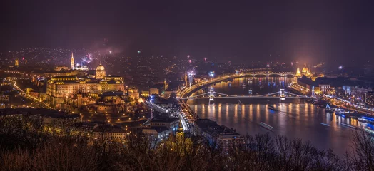 Muurstickers New Year Celebration. Fireworks over Budapest, Hungary. Illuminated Royal Palace by Danube River. © kaycco