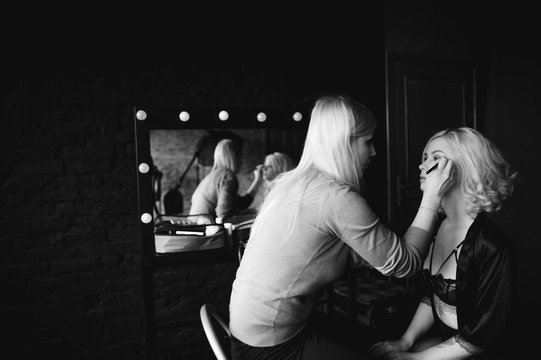 Backstage Scene: Professional Make-up Artist Doing Glamour Model Makeup At Work