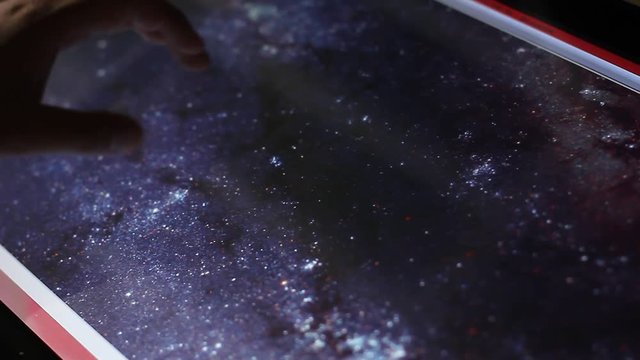 illustration of the deep space galaxies on touch screen computer