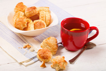 Tea with a lemon and cookies from puff pastry