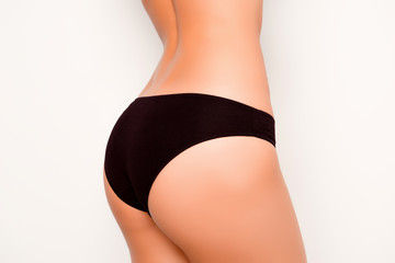 close up photo of girl's  fit shapely buttocks with black pantie