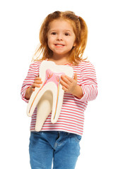 Cute little girl holding tooth model in her hands