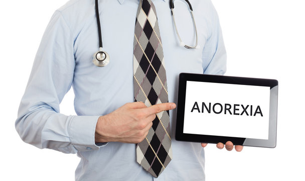 Doctor holding tablet - Anorexia