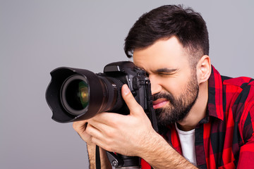 Close up portrait of attractive man shoting with camera