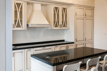White contemporary kitchen with island