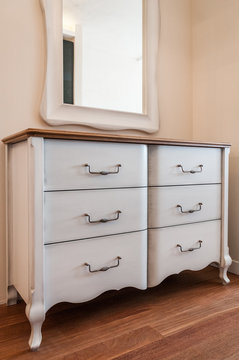 Mirror and commode in home interior