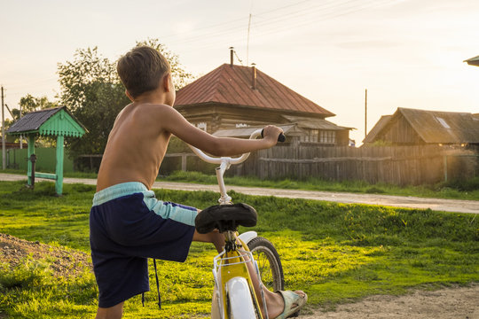 Mari Boy Riding Bicycle