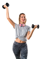 Fototapeta na wymiar Young woman doing weightlifting