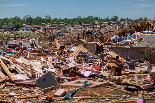 Propane Tanks Lined Up in front of debris from a destructive tornado