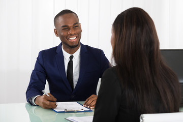 Male Manager Interviewing A Female Applicant