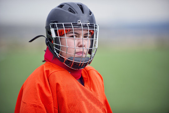 Portrait Of Teen Field Hockey Goalie Wearing Helmet