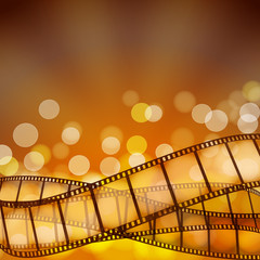 Naklejka premium cinema background with film strips and light rays. vector