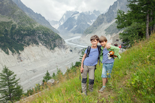 two little brother to pose in front of the glacier