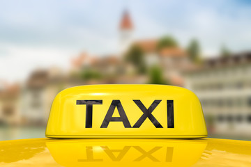 taxi for traveling with cityscape background